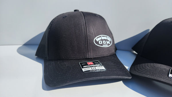 Black OOM Emblem Trucker Hat